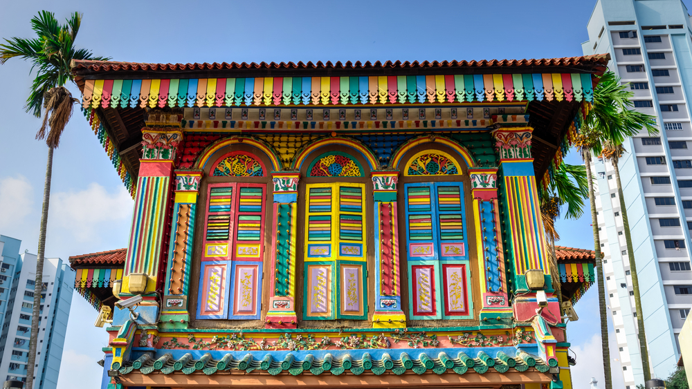 Colorful facade of building with clear blue sky in Little India, Singapore